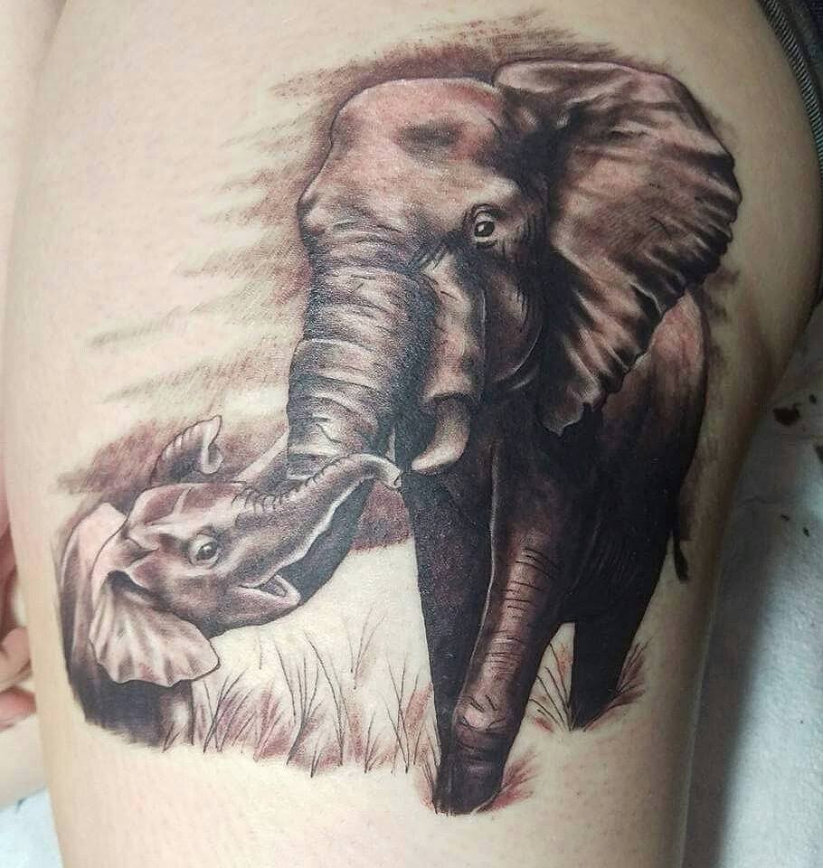Black Ink Elephant With Elephant Baby Tattoo On Left Hip By Laura Frego