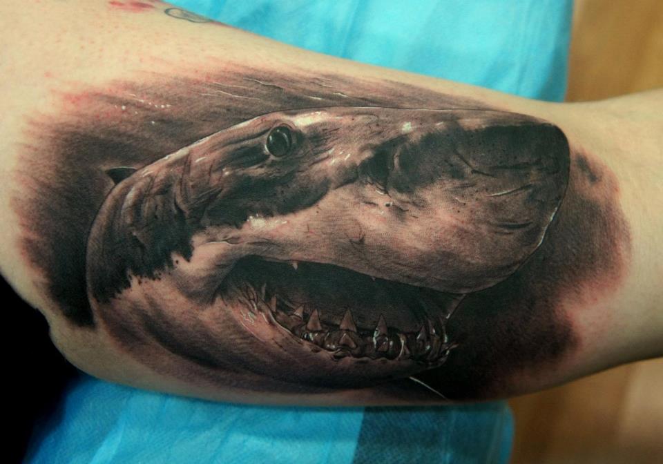 Black Ink Evil Shark Tattoo On Left Bicep By Fredy