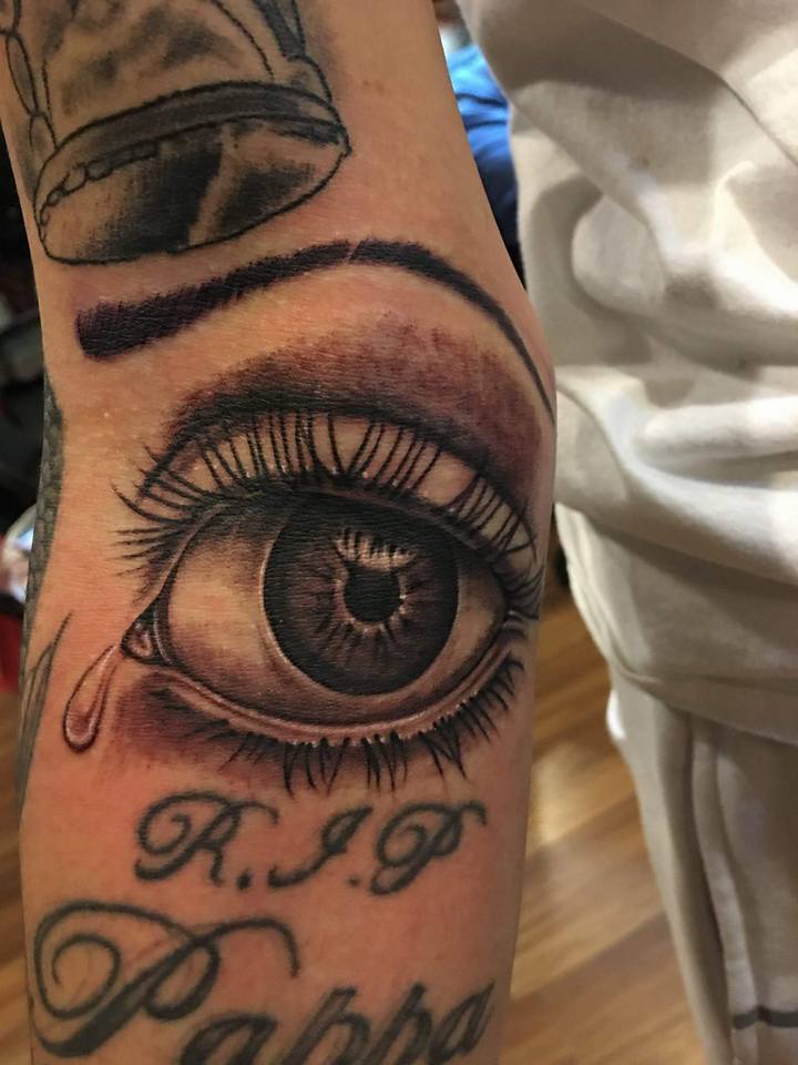 Black Ink Eye Tattoo On Arm By Zak Schulte