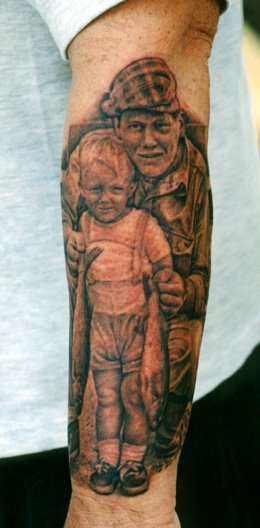 Black Ink Father With Son Portrait Tattoo On Left Arm By Tom Renshaw