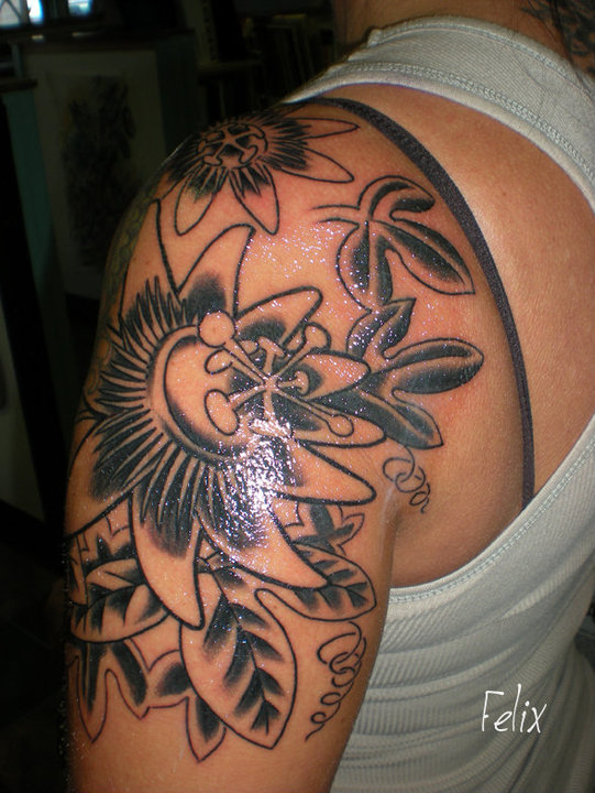Black Ink Flower Tattoo On Women Left Half Sleeve