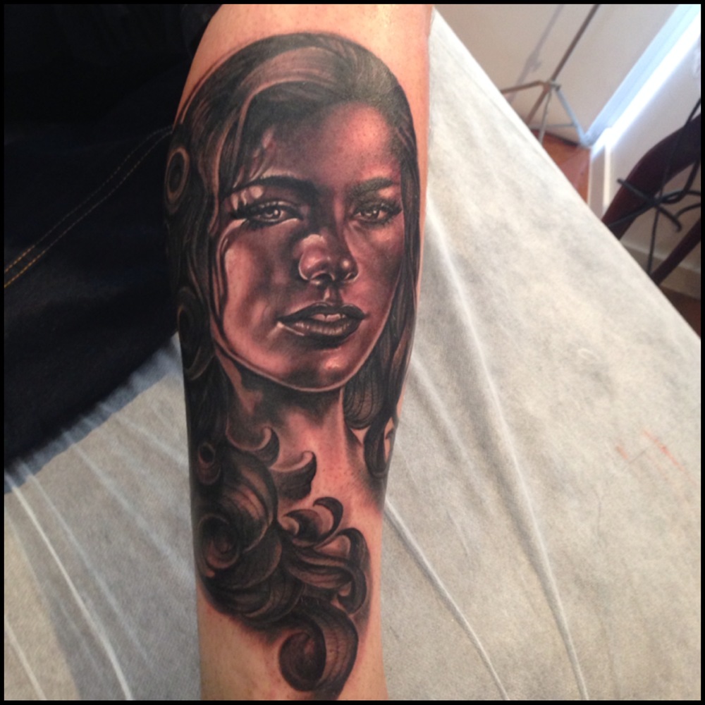 Black Ink Girl Face Tattoo On Forearm By Fabz