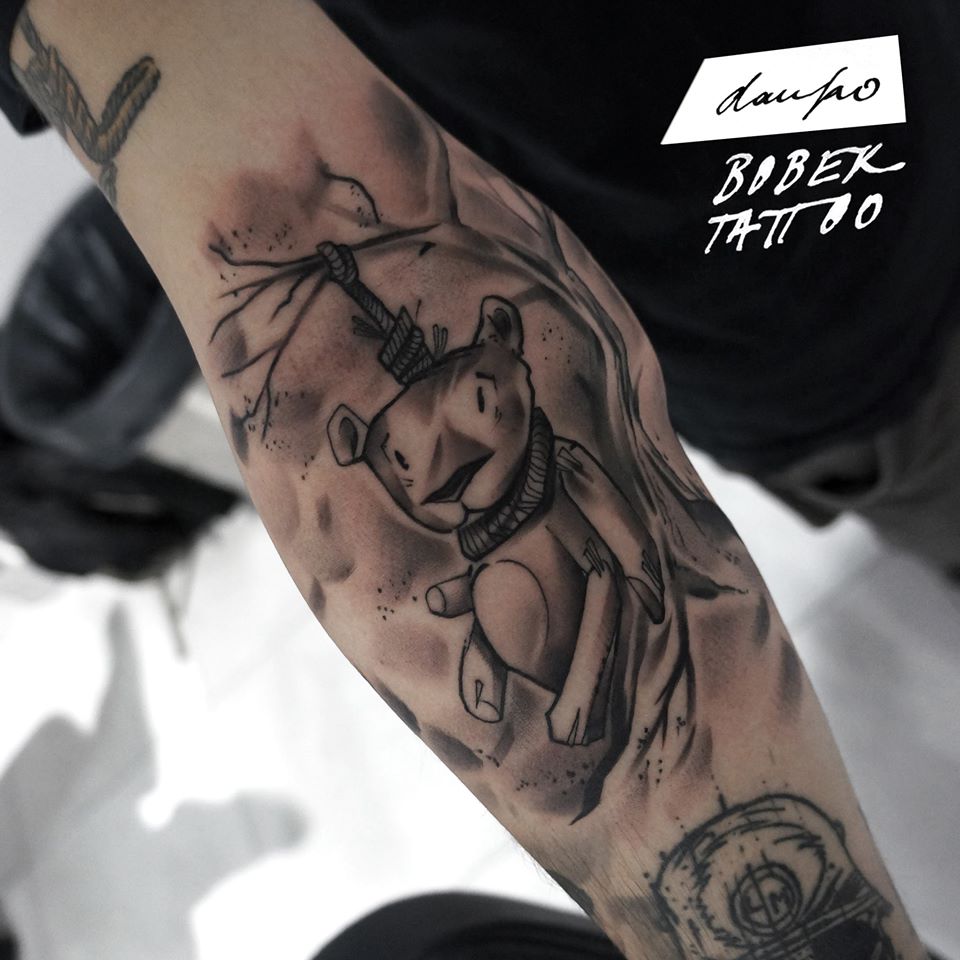 Black Ink Hanging Teddy Tattoo On Sleeve By Dan Ko