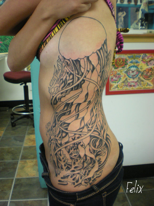 Black Ink Jellyfish Tattoo On Women Left Side Rib
