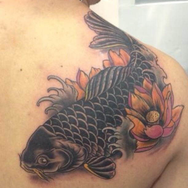 Black Ink Koi Fish With Flower Tattoo On Right Back Shoulder