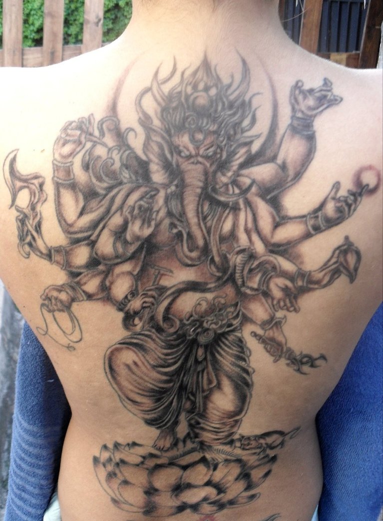 Black Ink Lord Ganesha On Lotus Tattoo On Full Back