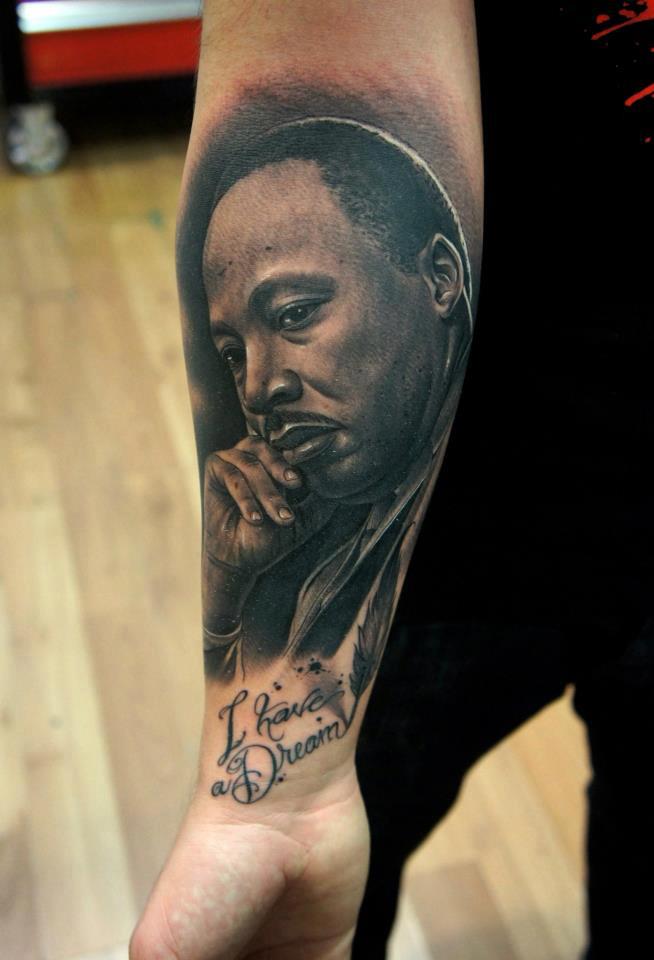 Black Ink Martin Luther King Jr Portrait Tattoo On Right Forearm