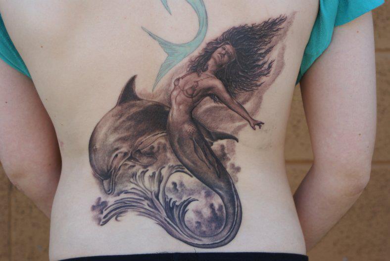 Black Ink Mermaid With Dolphin Tattoo On Back By Tom Renshaw