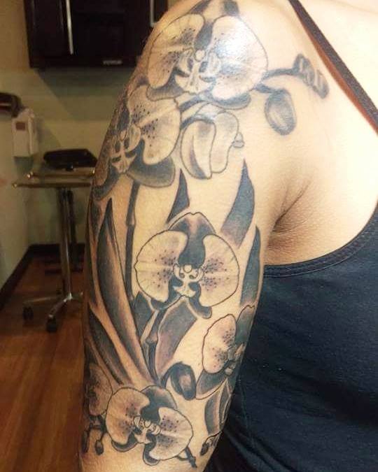 Black Ink Orchid Flowers Tattoo On Right Half Sleeve By Laura Frego