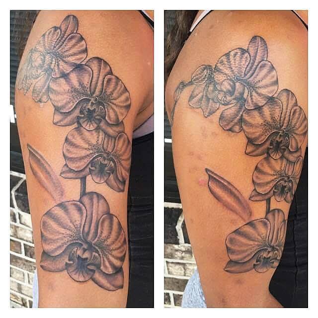 Black Ink Orchids Flowers Tattoo On Right Half Sleeve