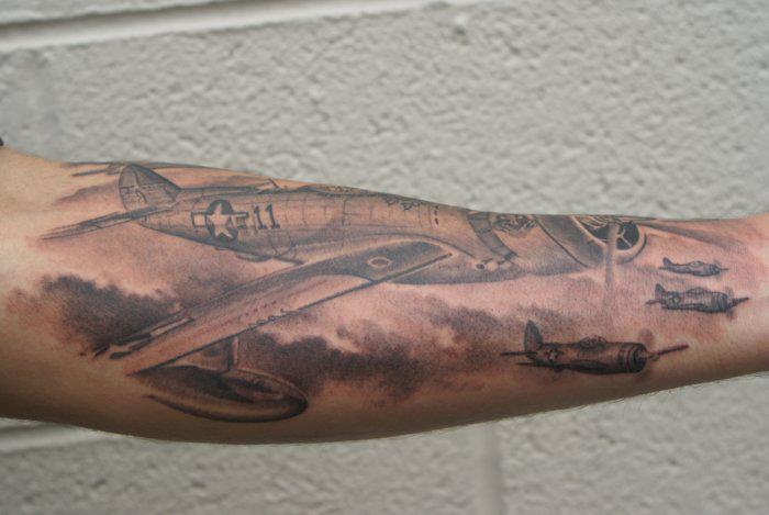 Black Ink Planes Tattoo On Right Arm By Tom Renshaw