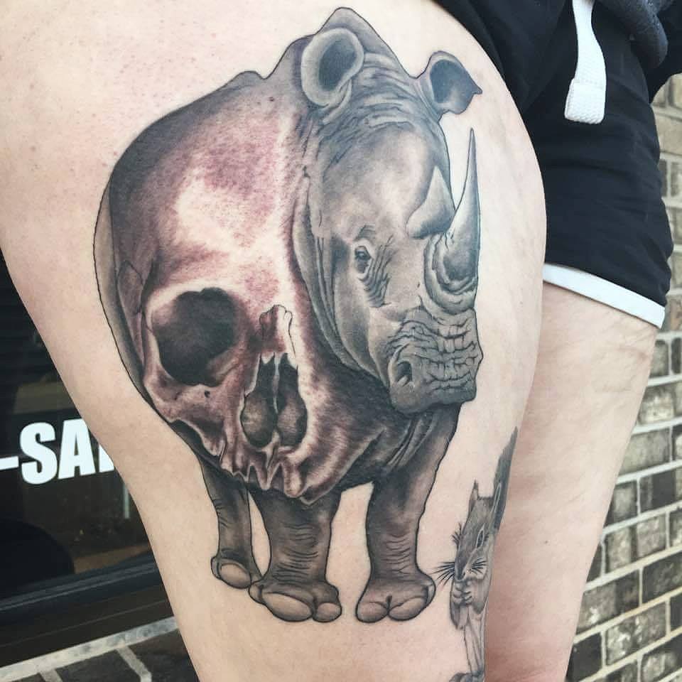 Black Ink Rhino With Skull Tattoo On Right Thigh By Zak Schulte