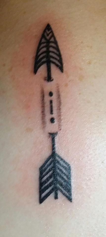 Black Ink Ripped Skin Arrow Tattoo Design By Jennie