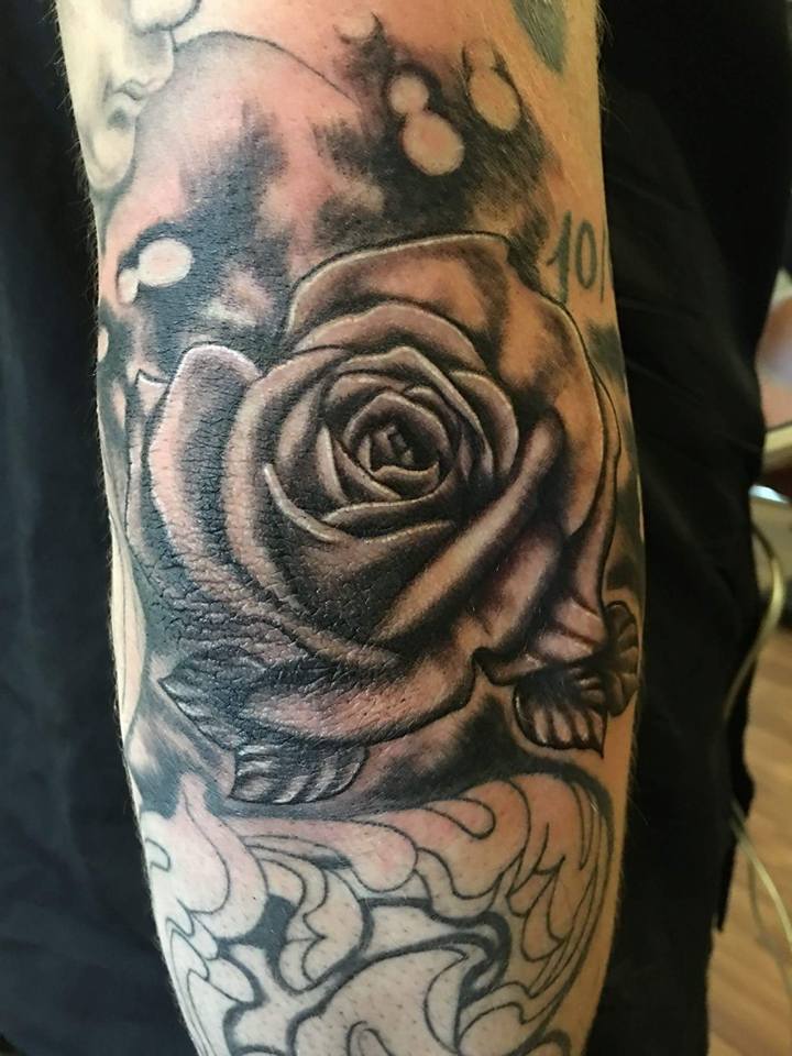 Black Ink Rose Tattoo On Left Arm