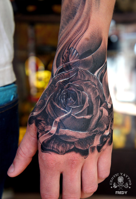 Black Ink Rose Tattoo On Left Hand