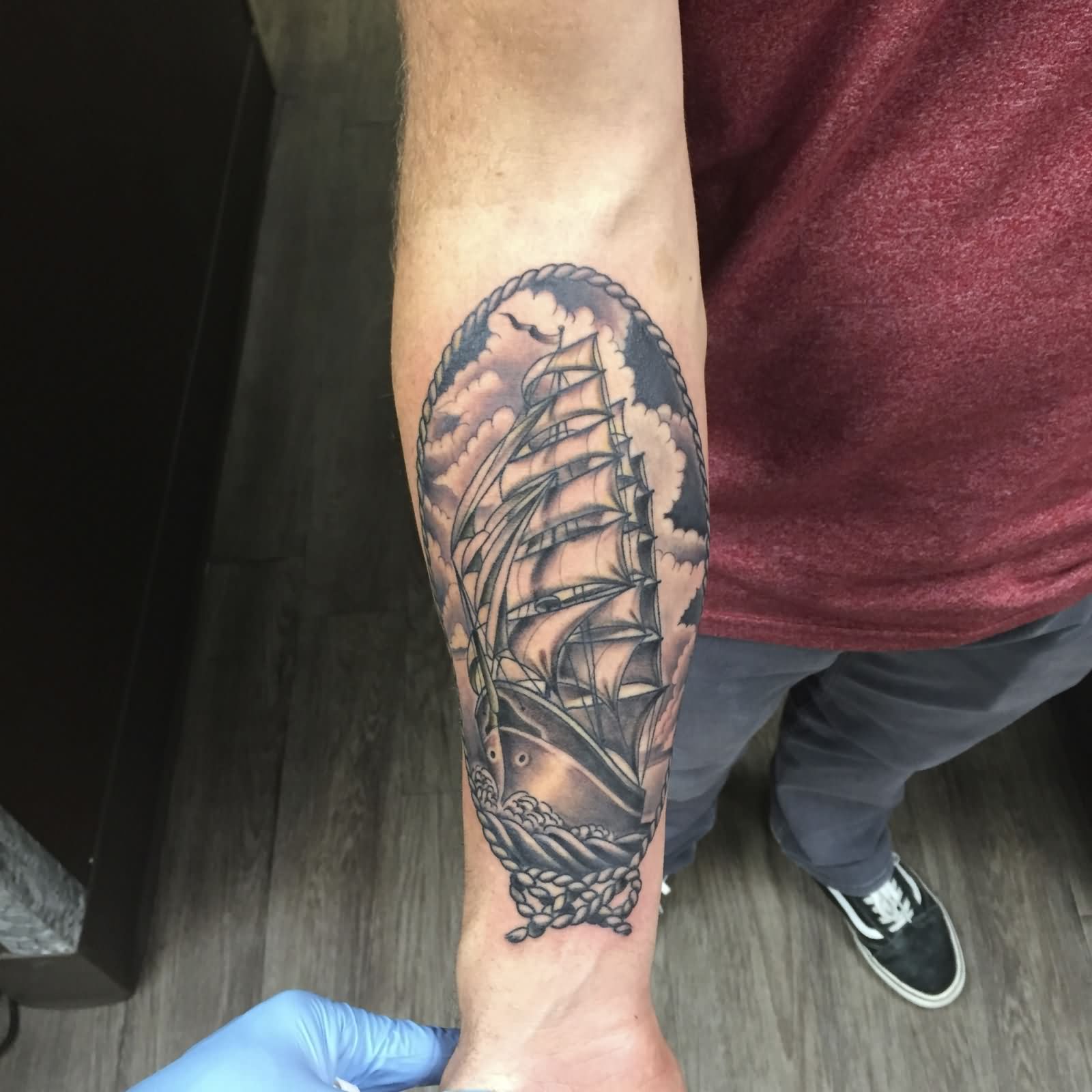 Black Ink Ship In Frame Tattoo On Right Forearm