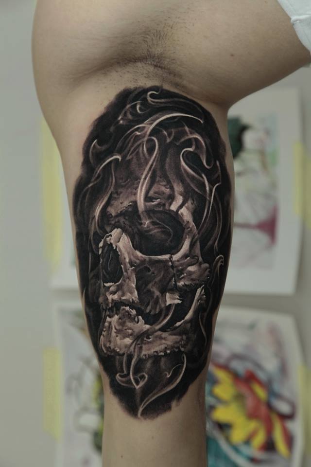 Black Ink Skull Tattoo On Bicep By Dmitriy Samohin