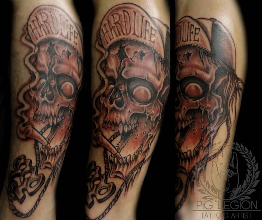 Black Ink Skull With Knuckle Tattoo On Leg Calf By Pig legion