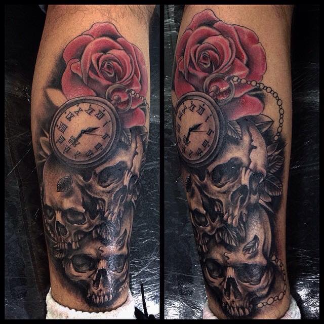 Black Ink Skulls With Pocket Watch And Rose Tattoo On Right Leg