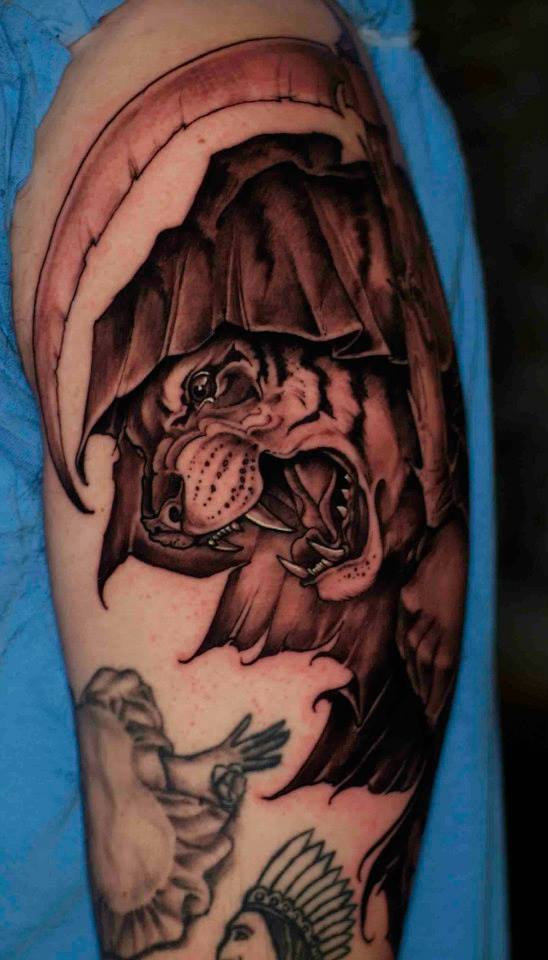Black Ink Tiger Head Tattoo On Left Half Sleeve