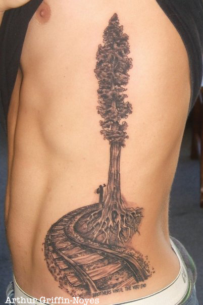 Black Ink Train Track With Tree Tattoo On Man Left Side Rib