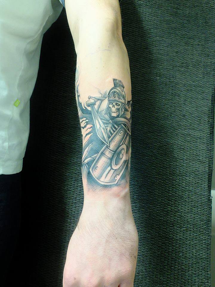 Black Ink Warrior Skeleton Tattoo On Left Arm