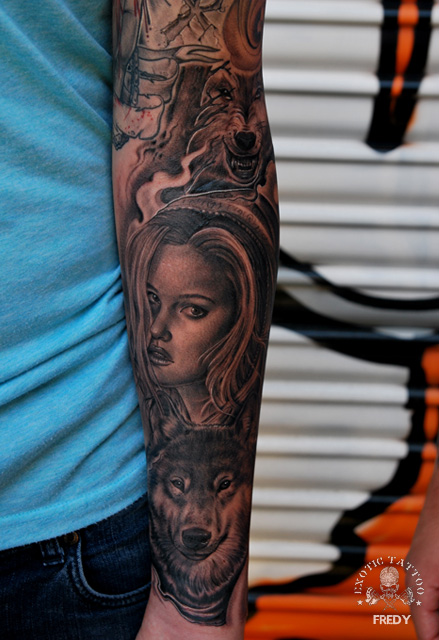 Black Ink Women Face With Wolf Tattoo On Left Forearm By Fredy