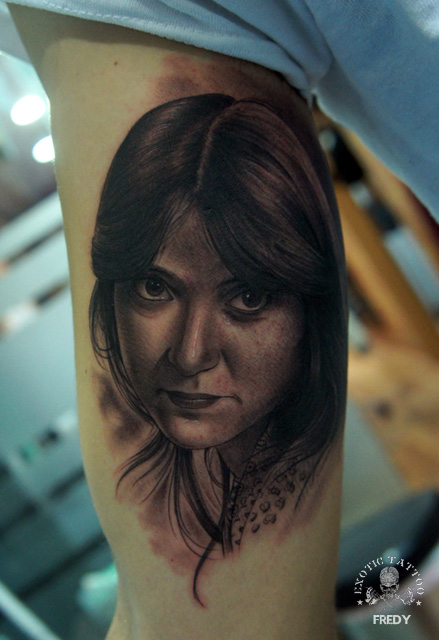 Black Ink Women Portrait Tattoo On Right Bicep By Fredy