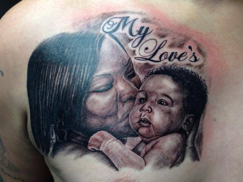 Black Ink Women With Baby Tattoo On Right Front Shoulder By Omar
