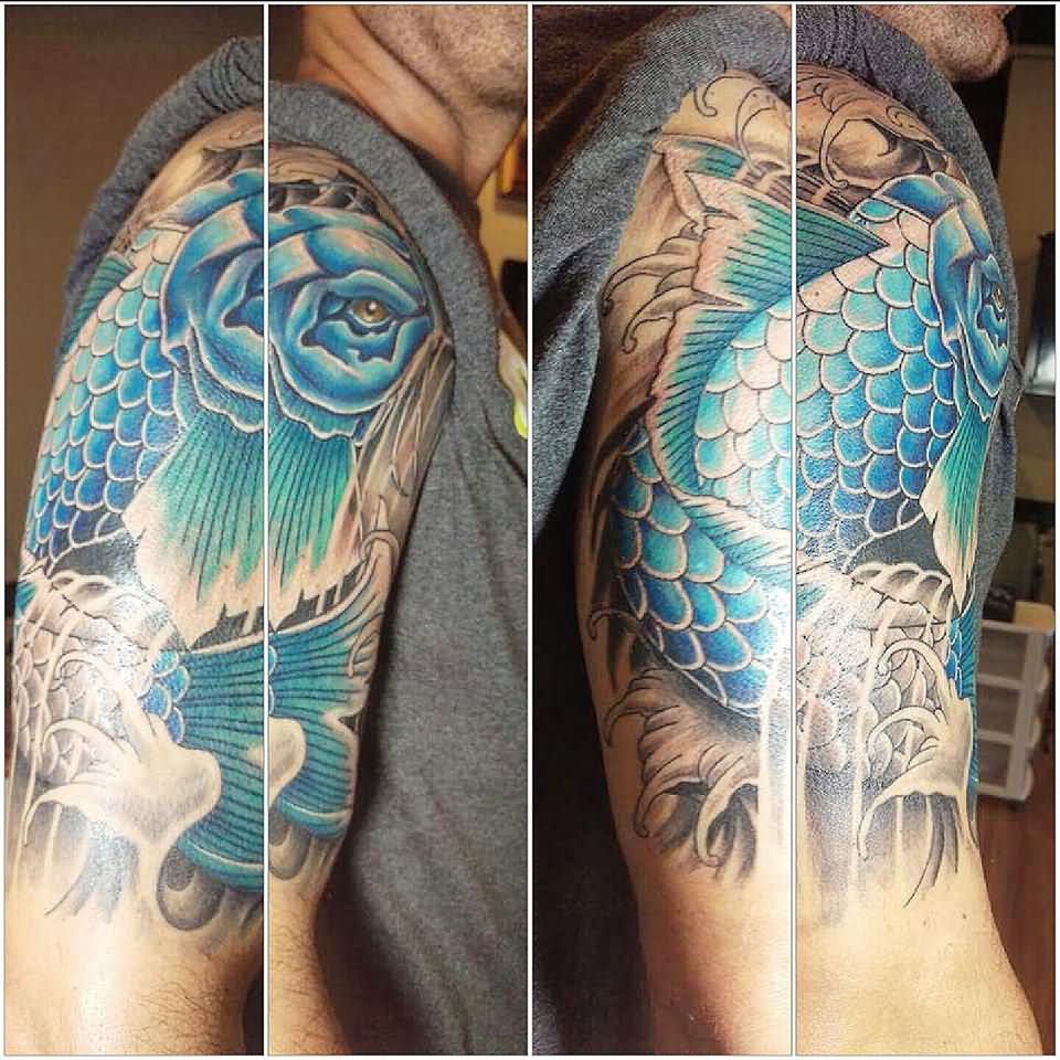 Blue Ink Koi Fish Tattoo On Man Right Half Sleeve By Laura Frego