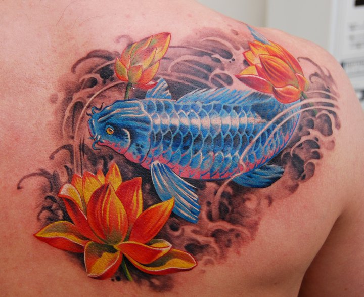 Blue Ink Koi Fish With Flower Tattoo On Right Back Shoulder