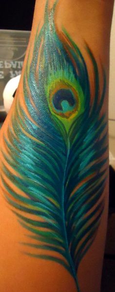 Blue Ink Peacock Feather Tattoo On Arm Sleeve