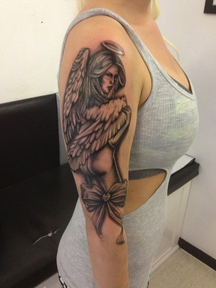 Bow And Angel Tattoo On Right Half Sleeve
