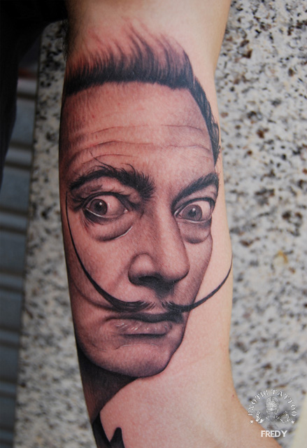 Classic Black And Grey Man Portrait Tattoo On Left Bicep By Fredy