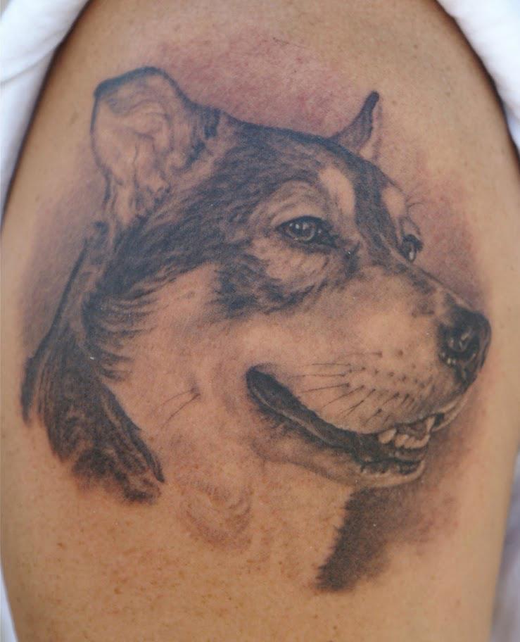 Classic Black Ink Dog Face Tattoo On Shoulder By Tom Renshaw