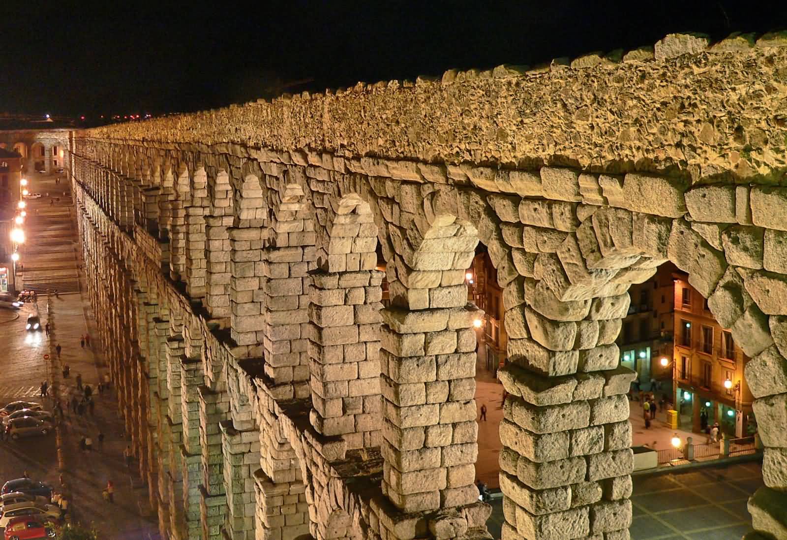 Closeup Of Aqueduct Of Segovia Lit Up At Night