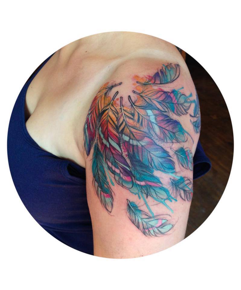 Colorful Feathers Tattoo On Women Left Shoulder