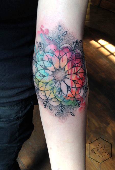 Colorful Geometric Flower Tattoo On Left Forearm