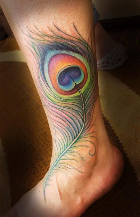 Colorful Peacock Feather Tattoo On Left Leg