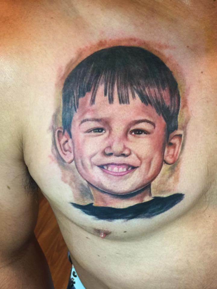 Cool Boy Face Portrait Tattoo On Man Right Chest