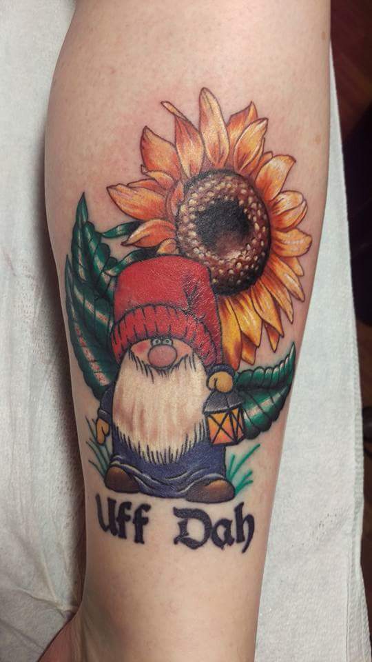 Cool Gnome With Sunflower Tattoo On Right Arm By Laura Frego