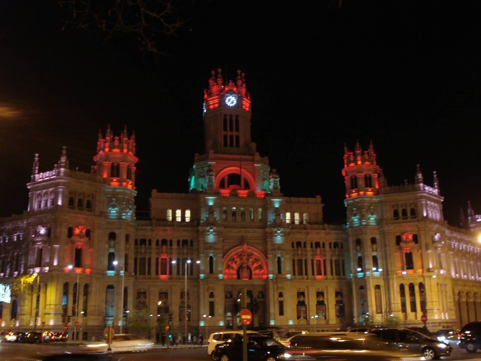 Cybele Palace With Colorful Lights At Night In Madrid