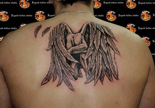 Fallen Angel Tattoo On Man Upper Back