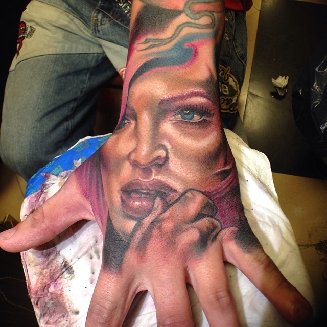 Fantastic Girl Face Tattoo On Left Hand