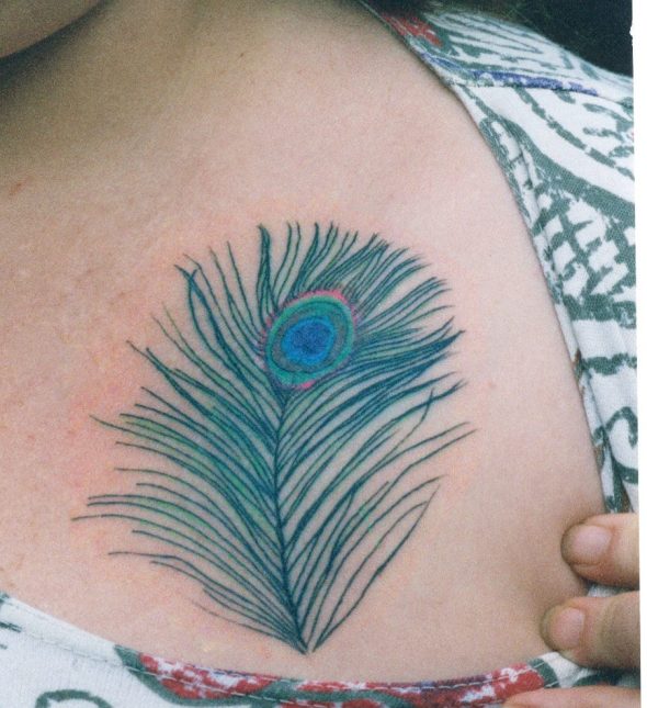Girl showing Her Peacock Feather Tattoo