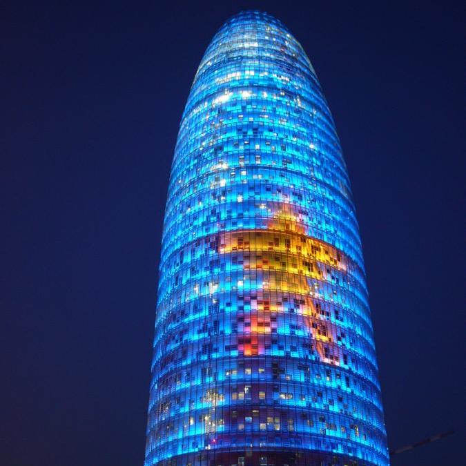 Golden Star Design On Torre Agbar With Night Lights