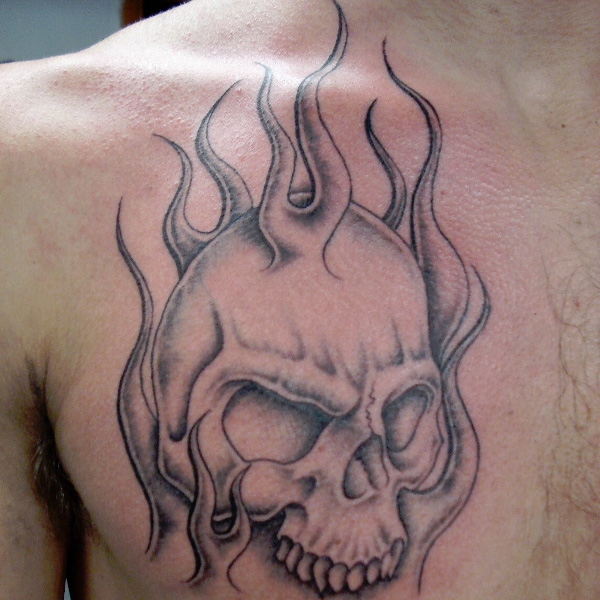 Grey Flaming Skull Tattoo On Chest