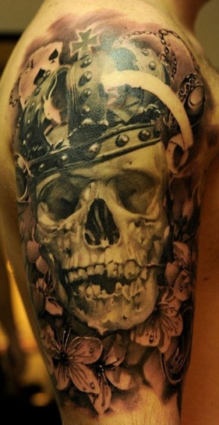 Grey Flowers And Skull With Crown Tattoo On Right Half Sleeve