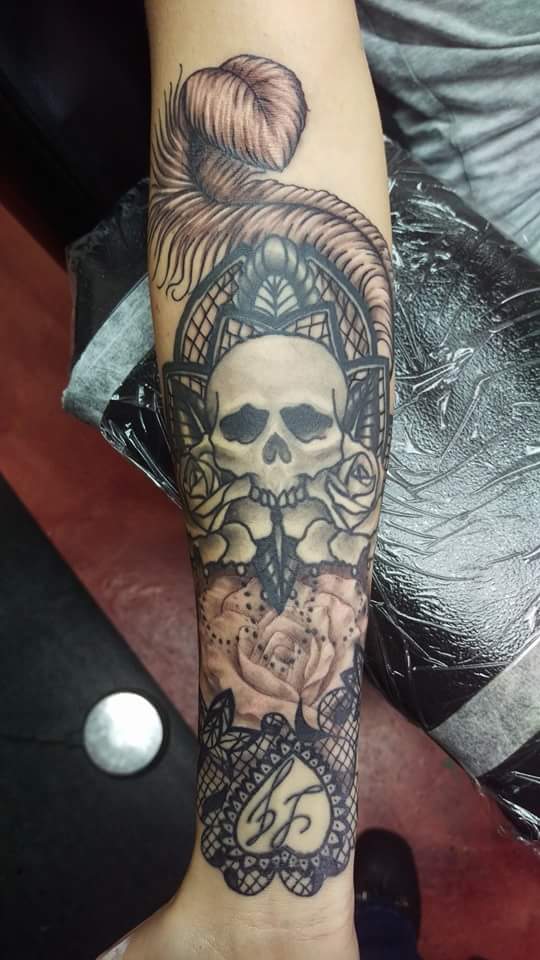 Grey Ink Skull With Roses Tattoo On Right Forearm