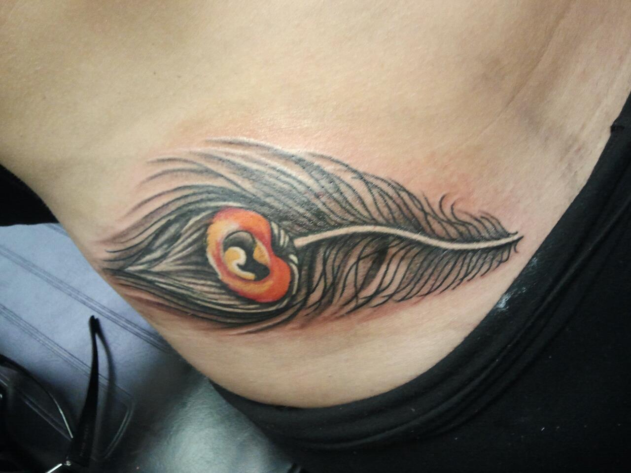 Grey Peacock Feather Tattoo On Hip
